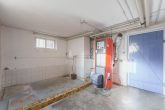 Heiz-und Waschraum - Einfa­mi­li­en­haus mit Garten, Garage und Ausbau­mög­lich­keiten